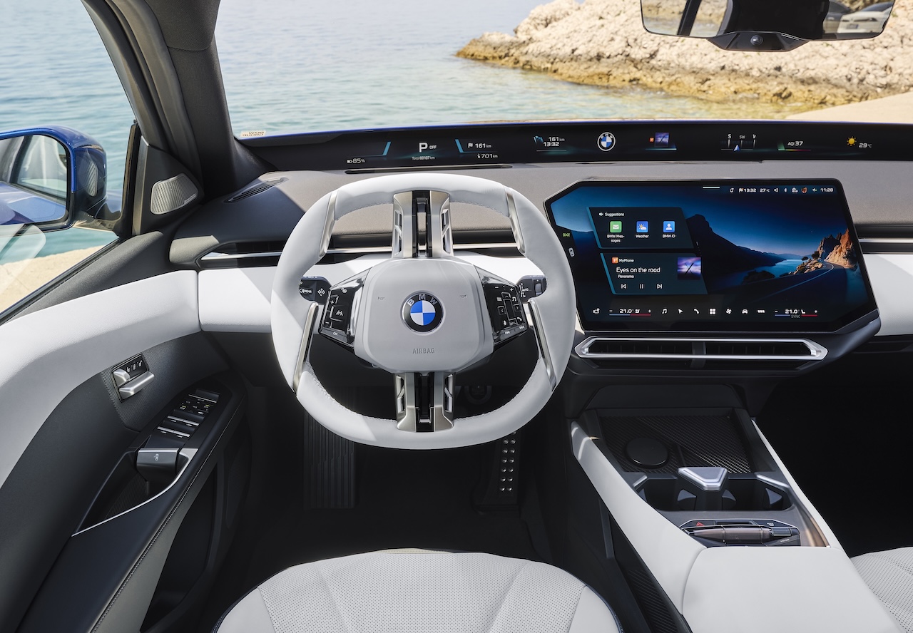 BMW i3 Sedan dashboard and steering wheel inside the driver-focused cockpit