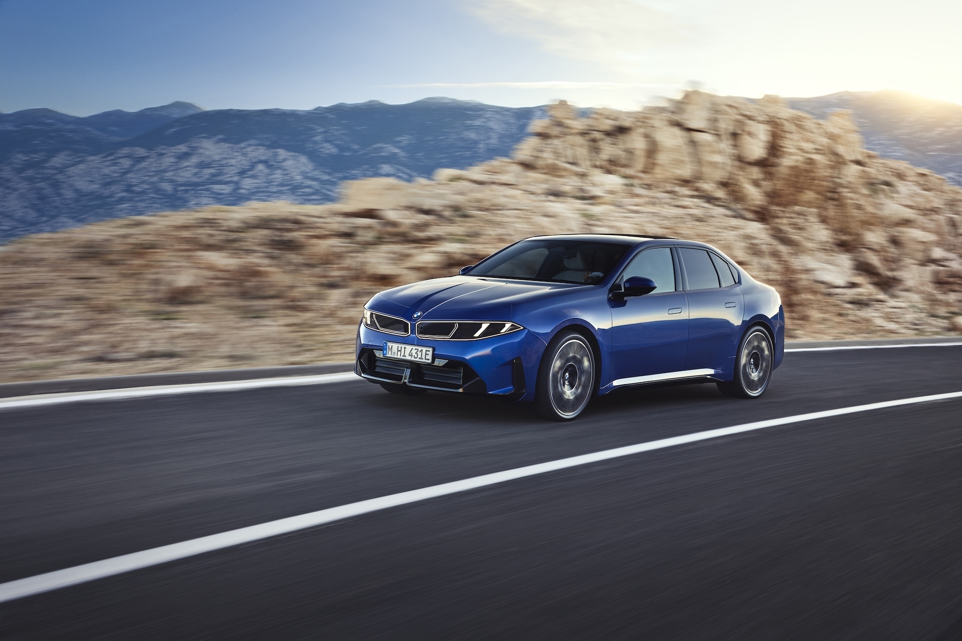 BMW i3 Sedan electric sports sedan driving, front three-quarter view, available at BMW of Freeport in Freeport, NY