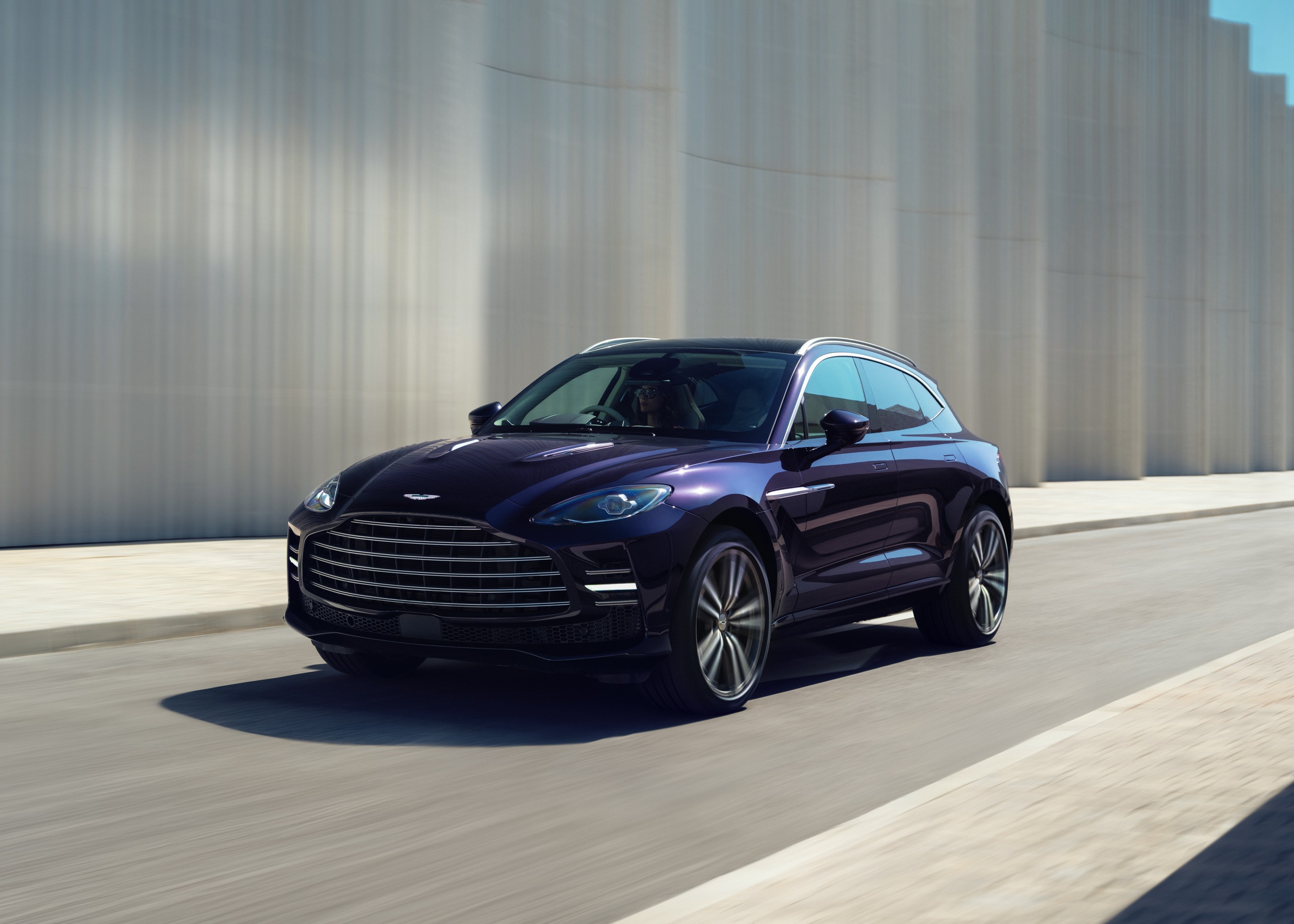 Aston Martin DBX GT driving, front three-quarter view