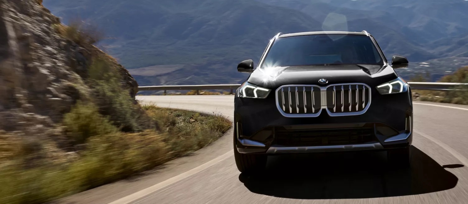 BMW X1 luxury compact SUV showcasing its sport-forward exterior design and performance-oriented stance.