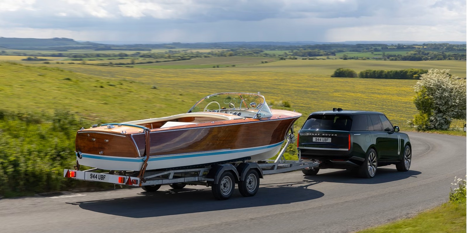 Range Rover Electric towing a boat