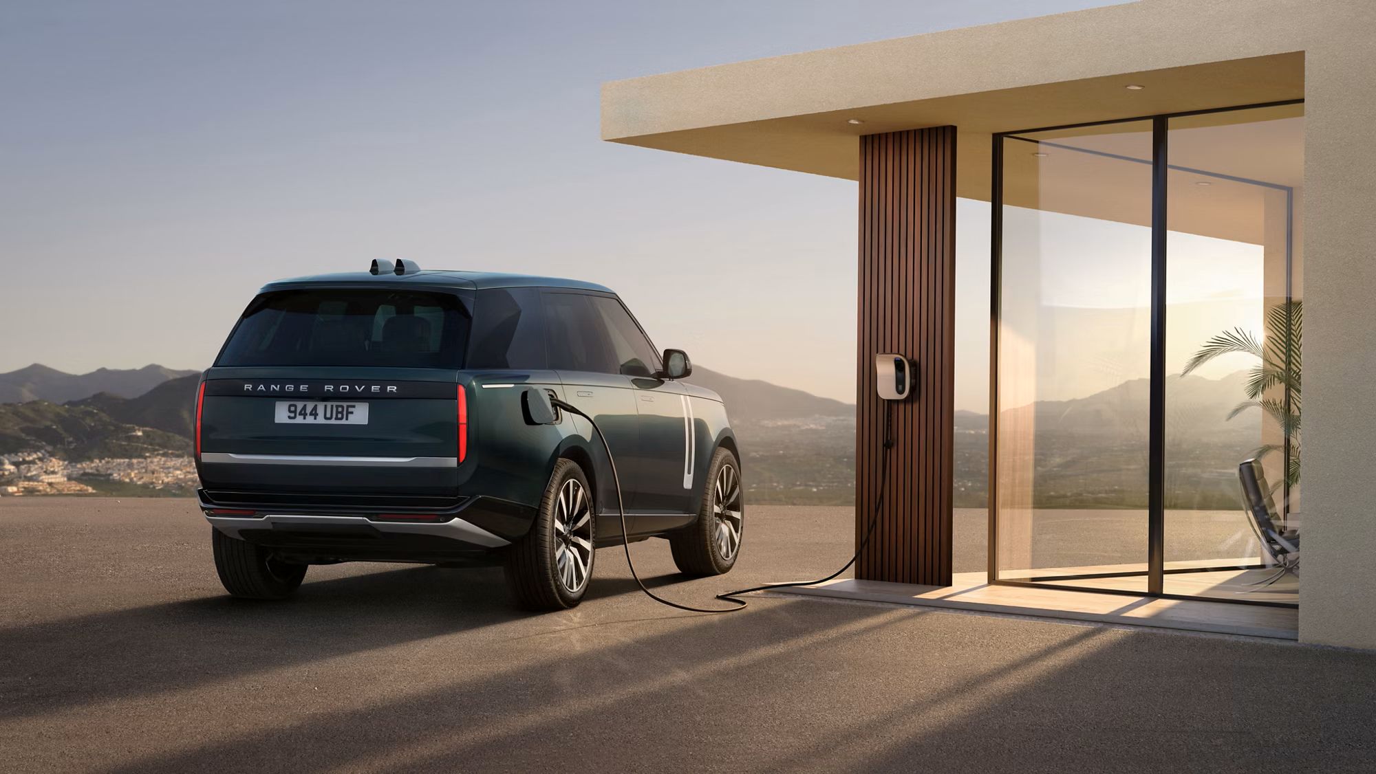 Range Rover Electric plugged in and charging at home