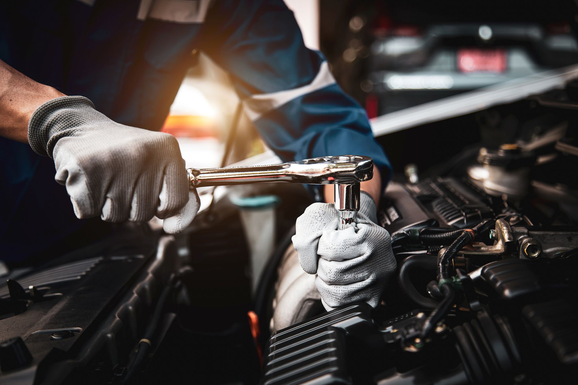 Volkswagen service technician preparing tires for road trip maintenance at Volkswagen of Naples Service Center