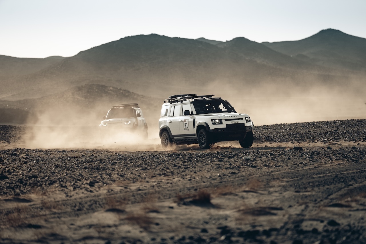 Land Rover Defender on a Dakar-style desert off-road expedition, highlighting rugged capability for Winter Park drivers exploring Land Rover SUVs at Land Rover South Orlando