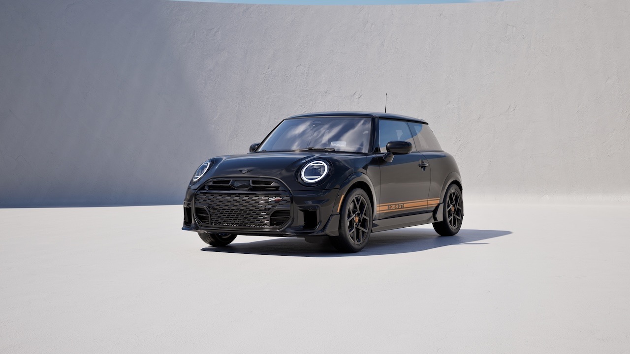 MINI 1998 GT Edition front angle view in Midnight Black Metallic with JCW front winglets