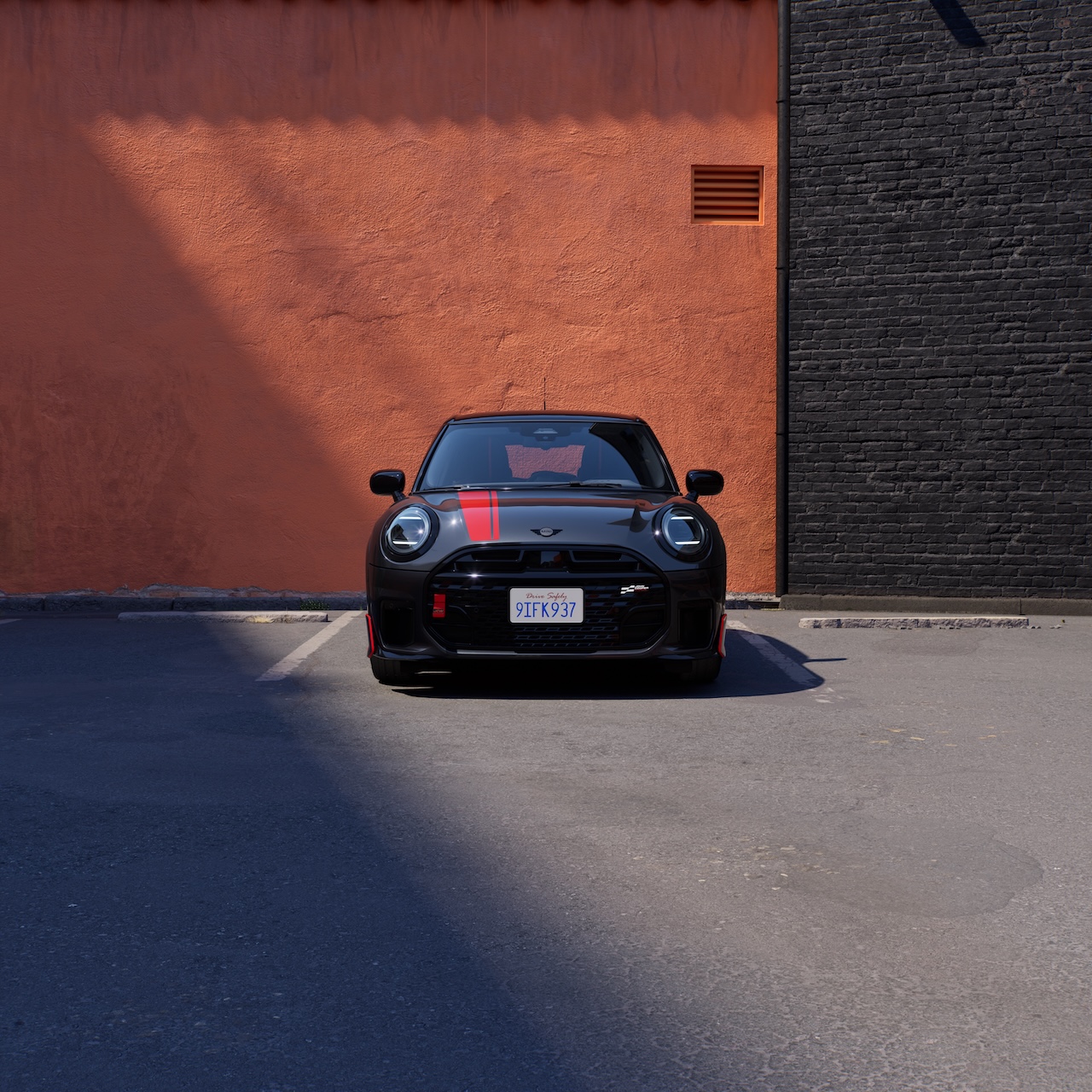 Wide front-facing view of the 2026 MINI Red Line Edition in Legend Grey Metallic