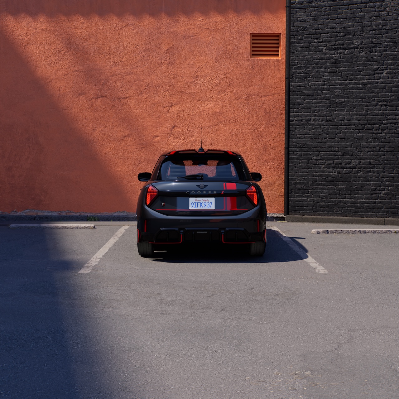2026 MINI Red Line Edition rear view showing JCW roof spoiler, rear diffuser, and aero body kit
