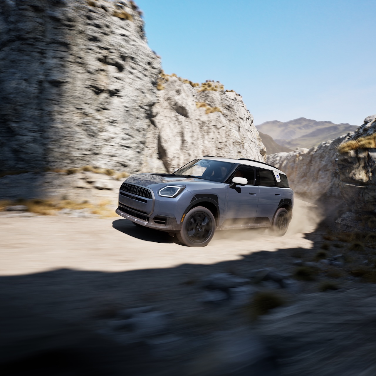 2026 MINI Countryman Untamed Edition ascending a steep rocky trail demonstrating Hill Descent Control off-road capability