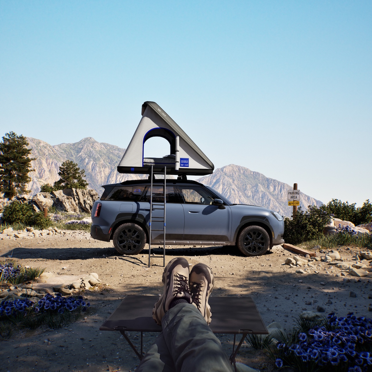 2026 MINI Countryman Untamed Edition parked at a campsite with optional roof tent accessory showing adventure lifestyle and Drive-off Support capability