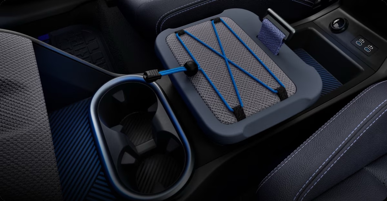 2026 MINI Countryman Untamed Edition interior showing two-tone dark heather grey knit fabric dashboard and door panels with intense blue background