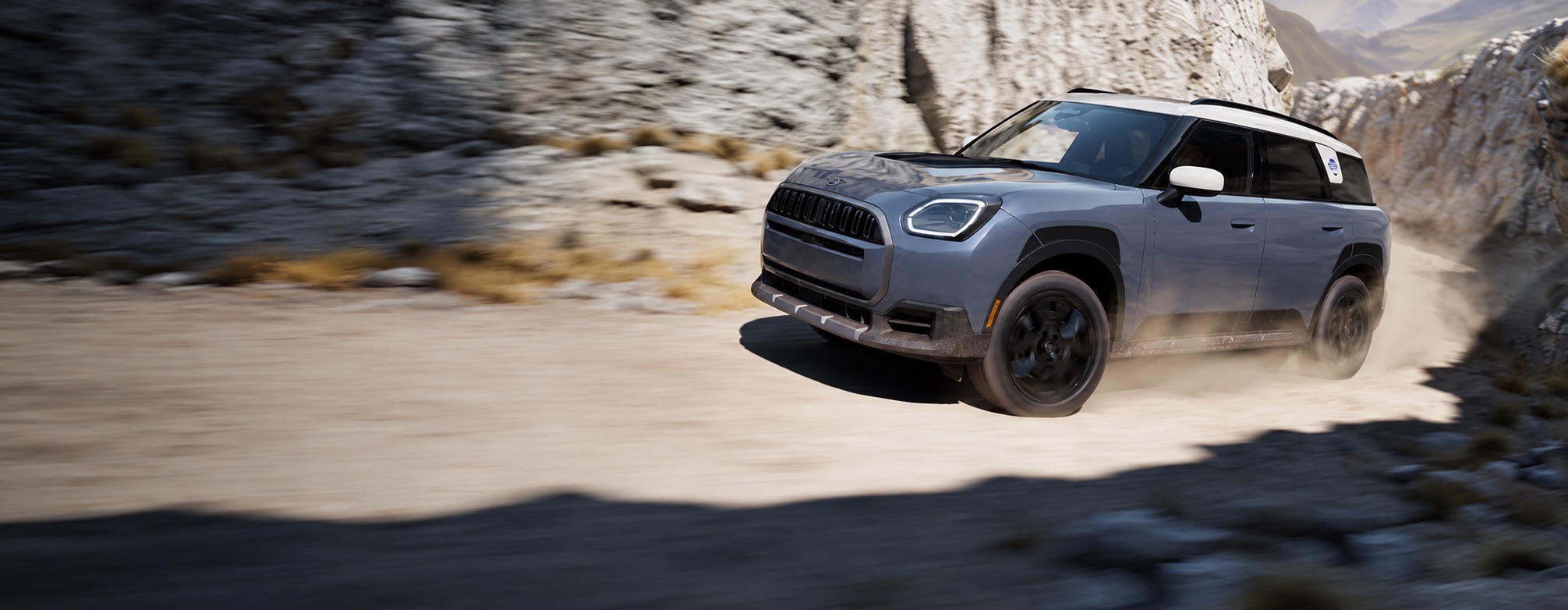 2026 MINI Countryman Untamed Edition driving on a mountain road, limited special edition Icon Drop available at MINI of Freeport in Freeport NY