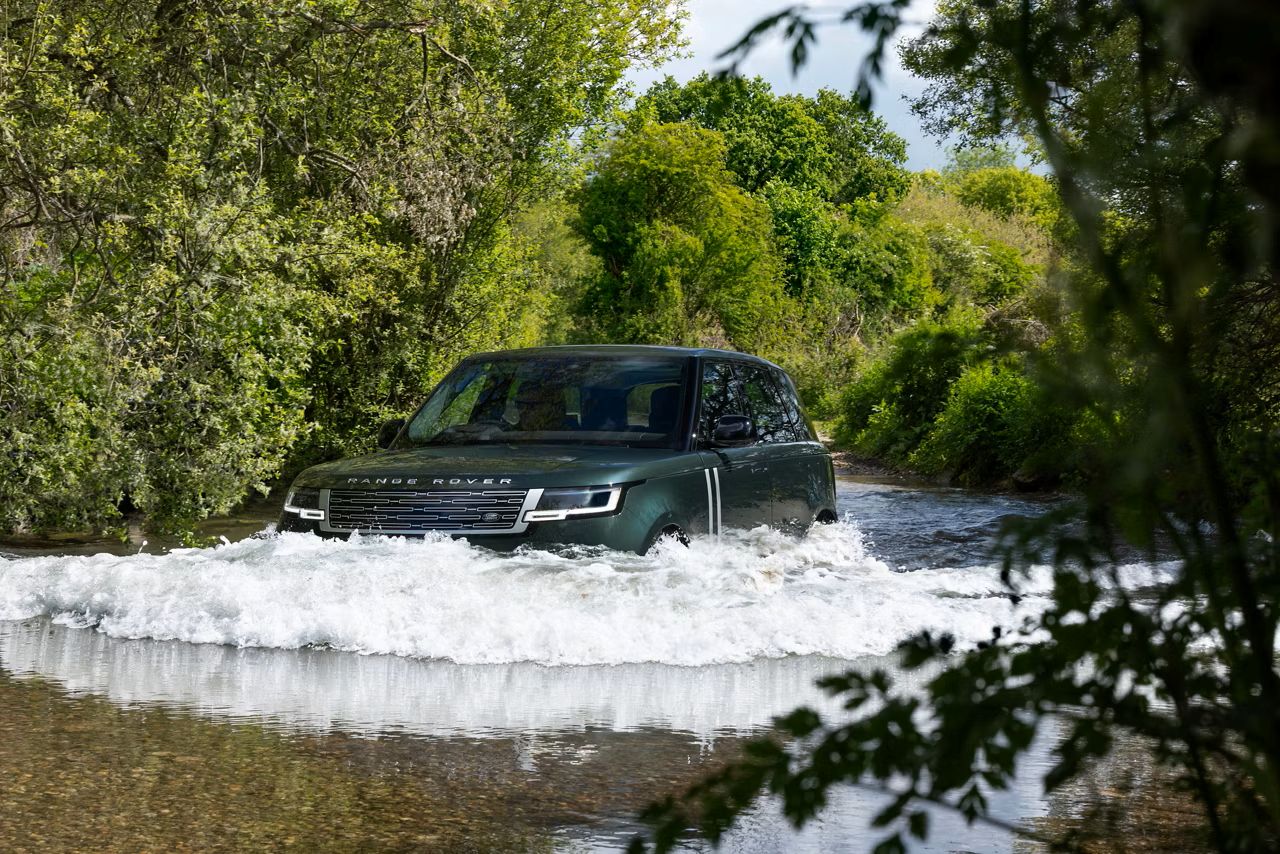 Range Rover Electric wading through a river